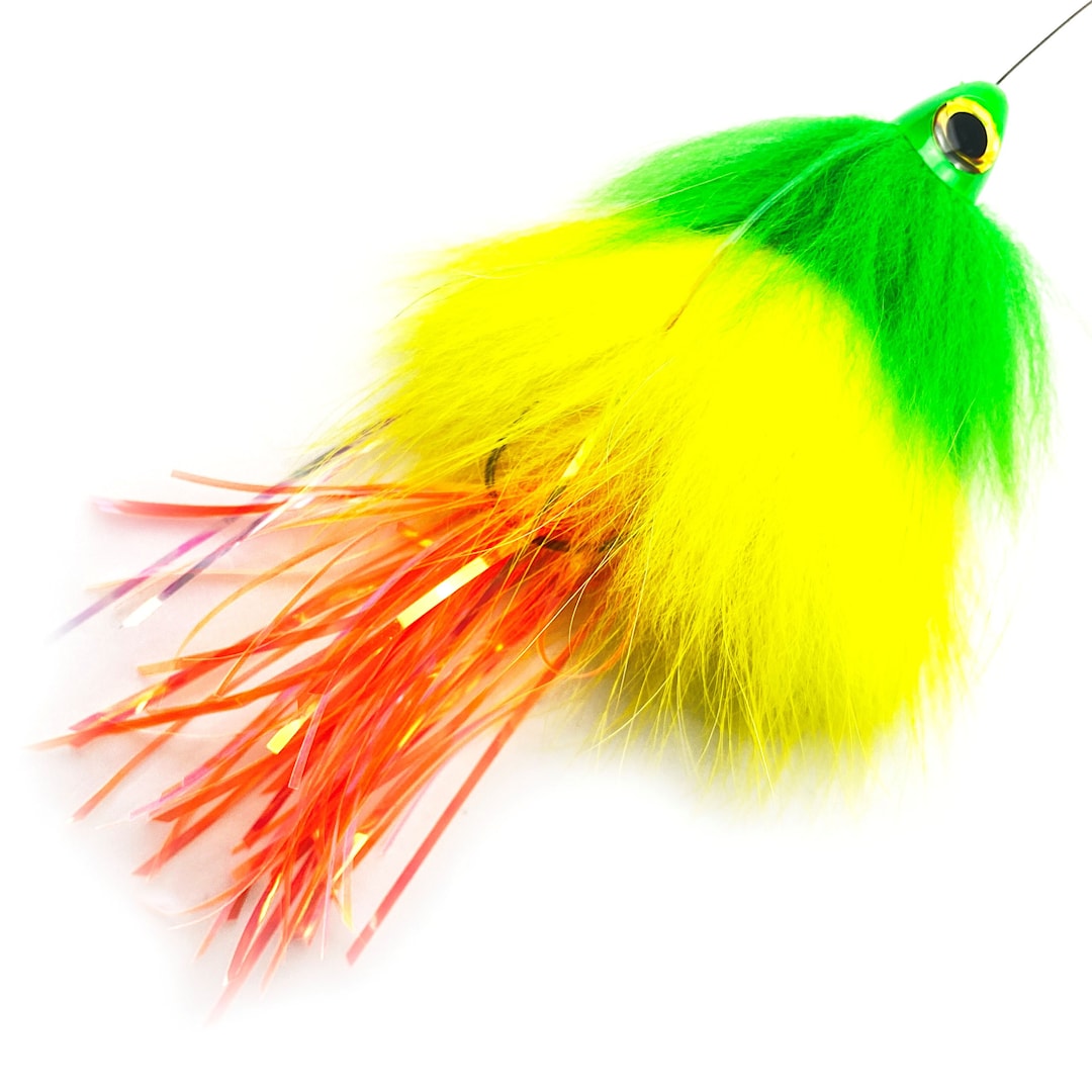 Läs mer om Spintube Pike 35 g kastfluga grön/gul/orange tinsel